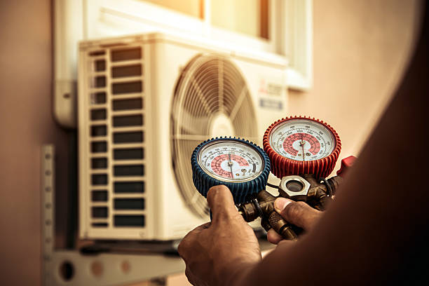Professional Air Conditioning Service technician working in Delmont, PA